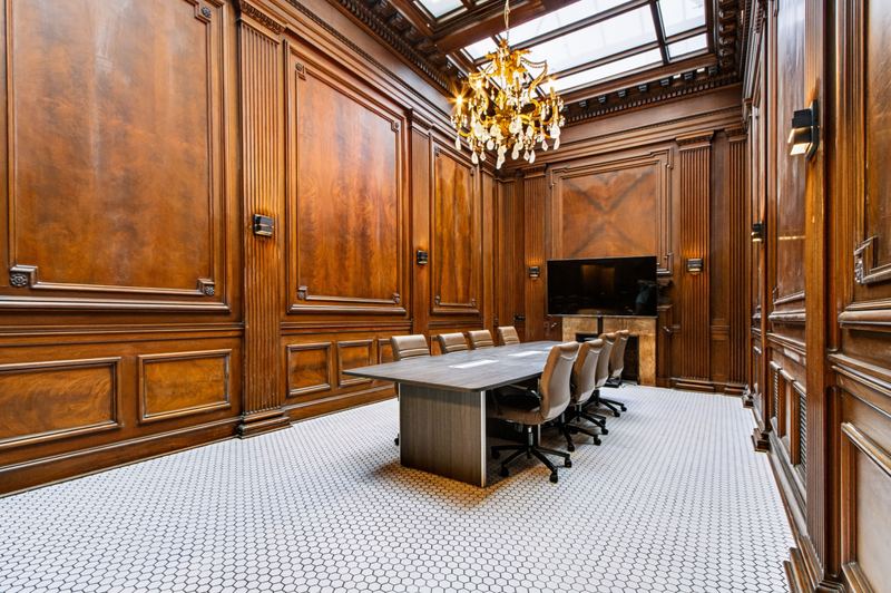 Conference table in the wood-paneled boardroom