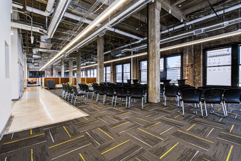 Open loft floor with rows of chairs set for a training